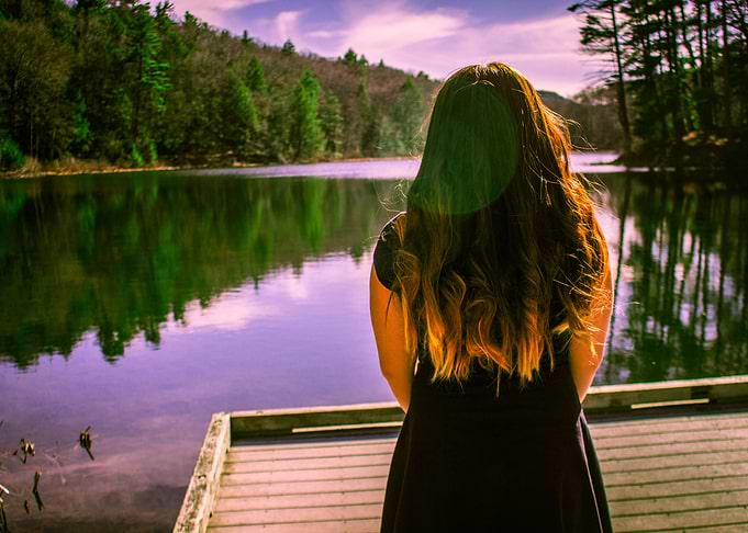 Girl Standing by Water