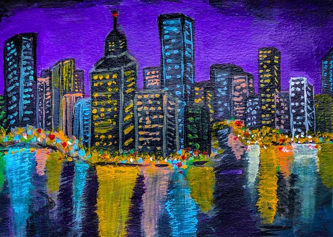 SKYLINE OF CITY AT NIGHT