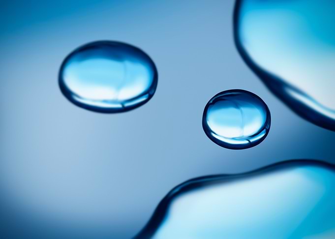 Beauty water drop on blue