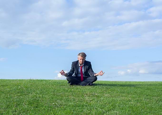 Businessman doing yoga