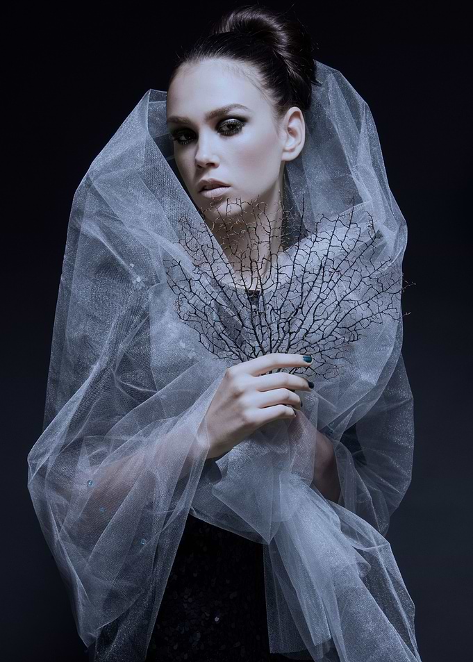 veiled woman on black