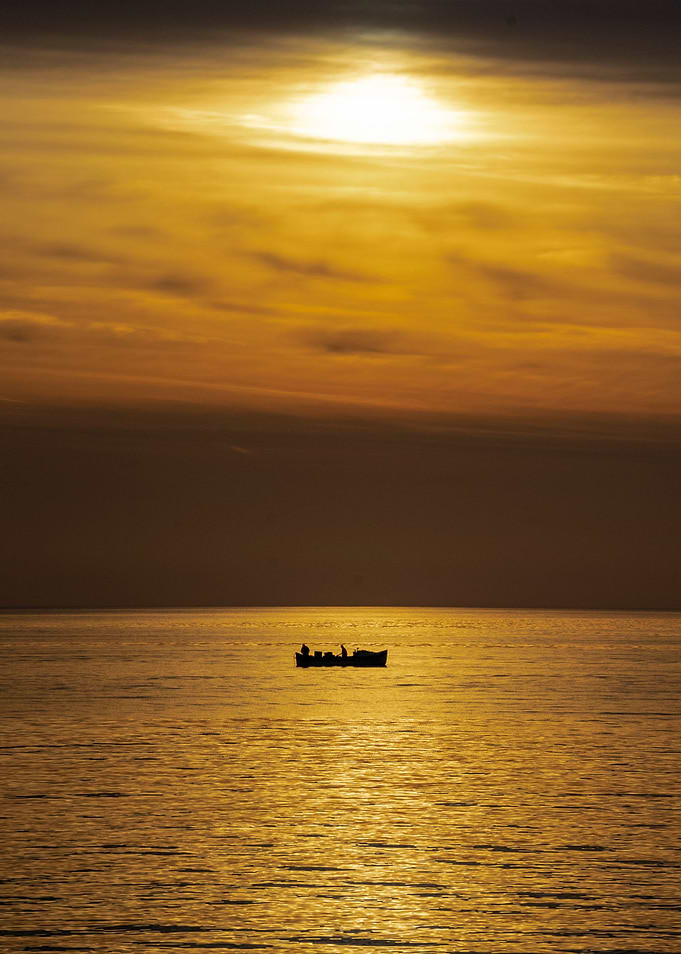 Fishing boat at sunrise