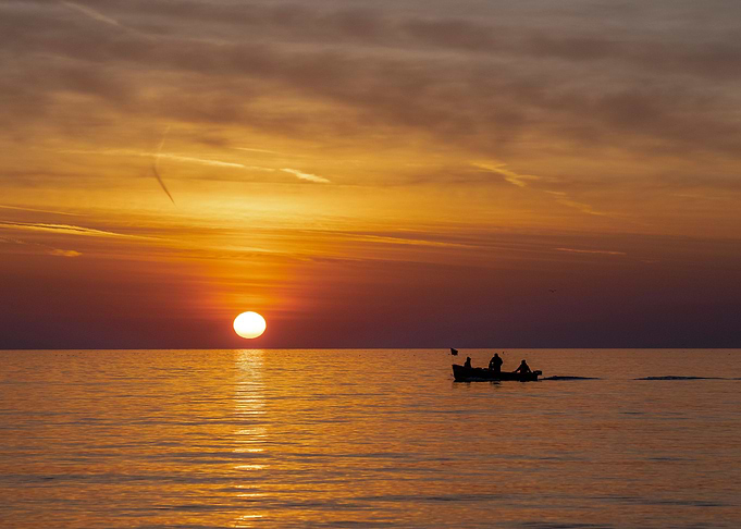 Fisherman in the sea