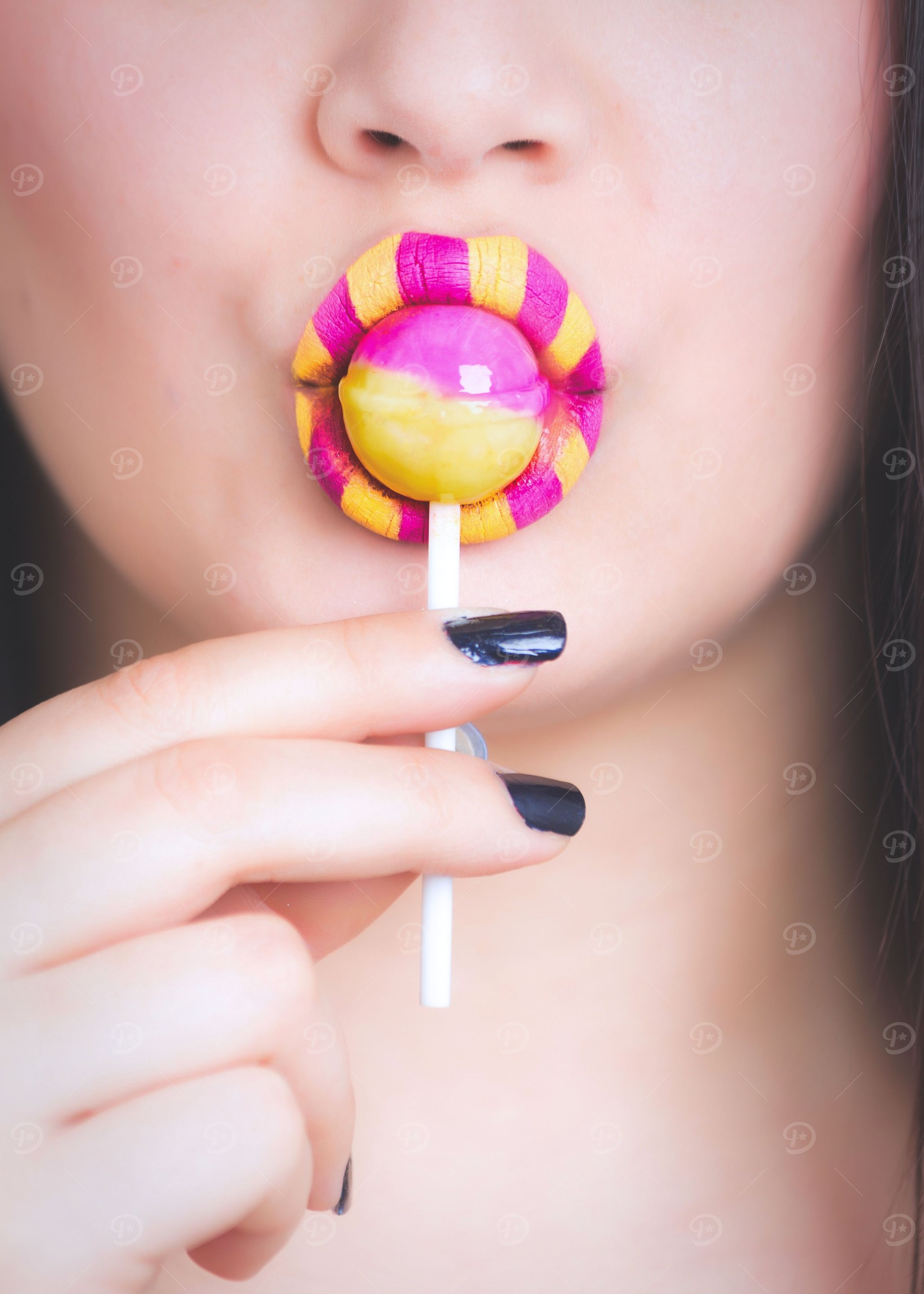 woman eating lollipop
