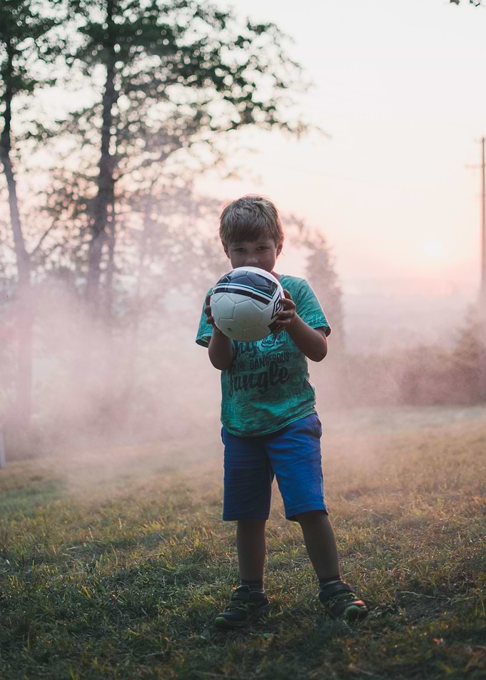 Kid holding ball