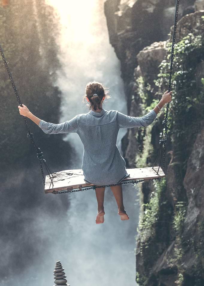woman sitting on a swing