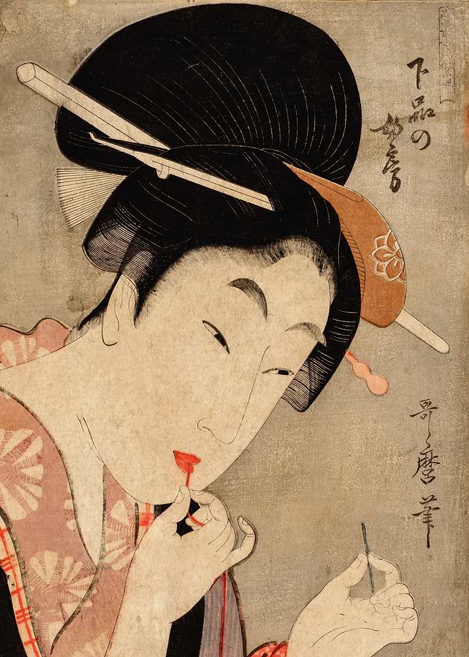 Geisha doing her make up