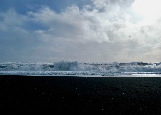 snow on the black sand