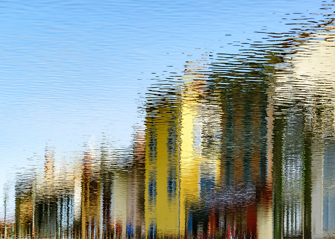 Colorful houses reflecting