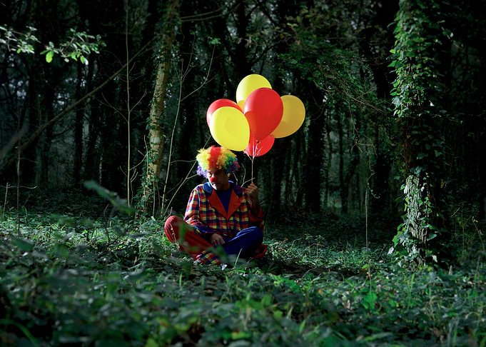 Clown man in the forest