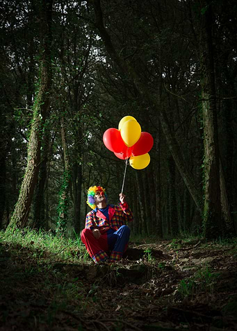Clown man in the forest