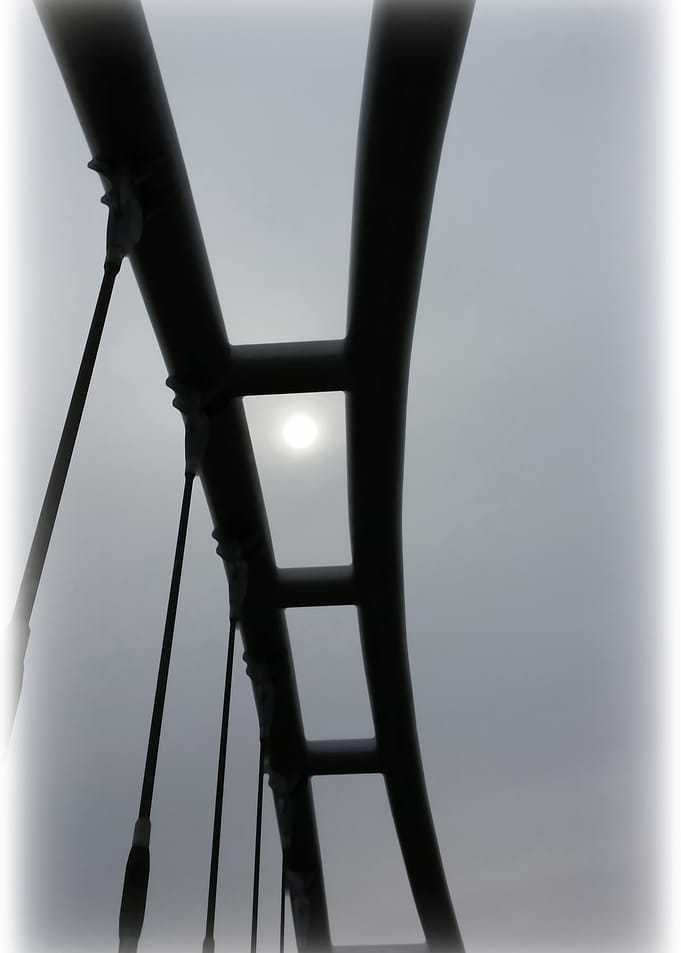 White sun over the bridge