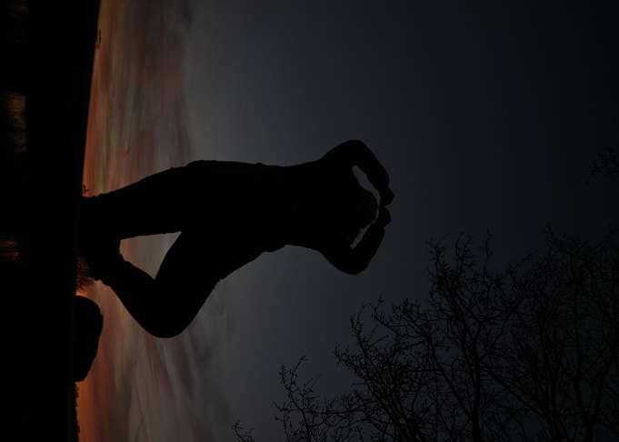 silhouette of woman at sun