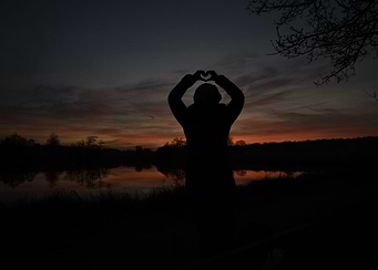 silhouette of woman at sun
