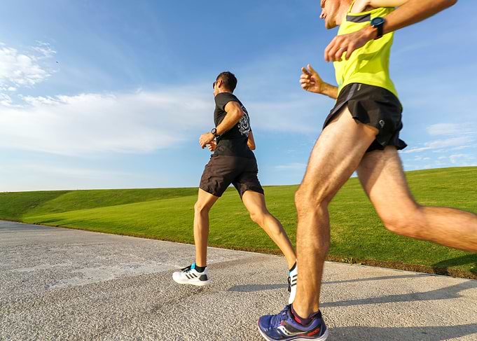 Two Men Running in Park