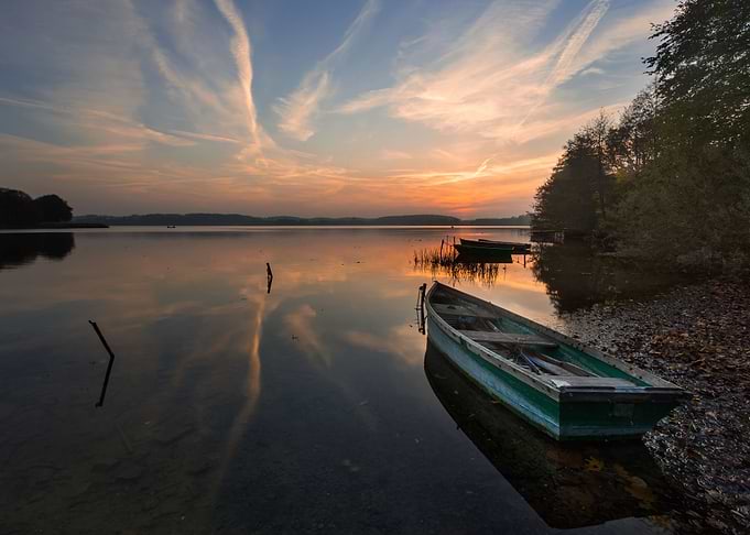 Sunset Lake With Fisherman