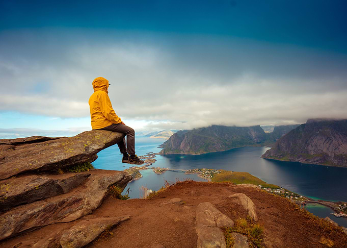 Male Tourist Sitting On Th