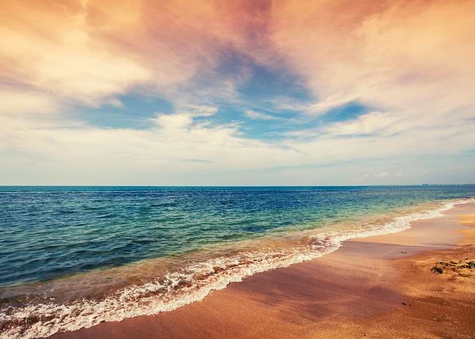Deserted Beach With Cloudy