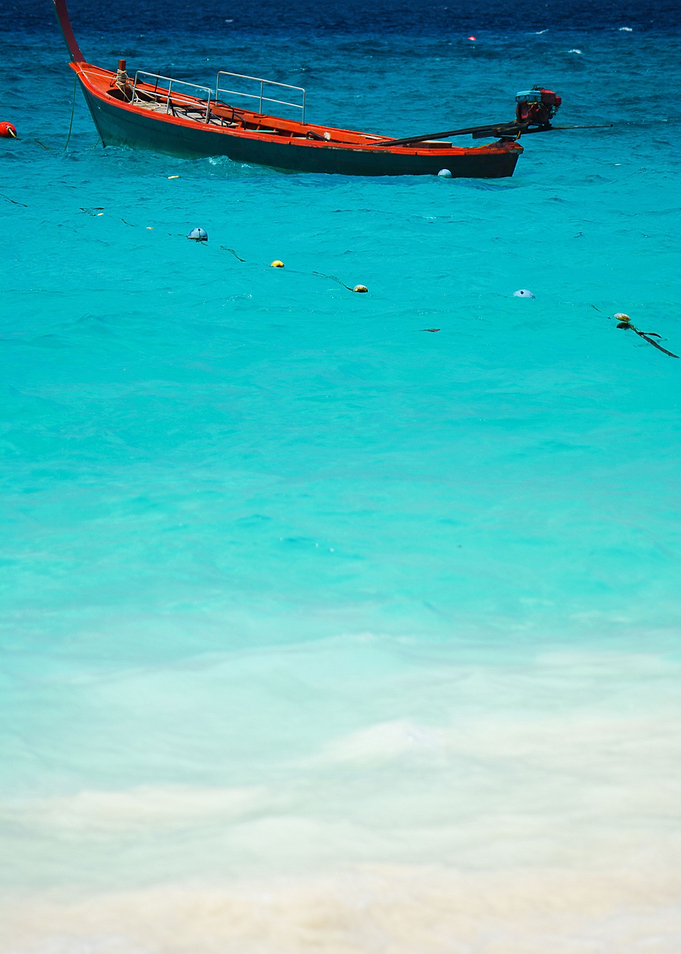 Red Boat On Beautiful Blue