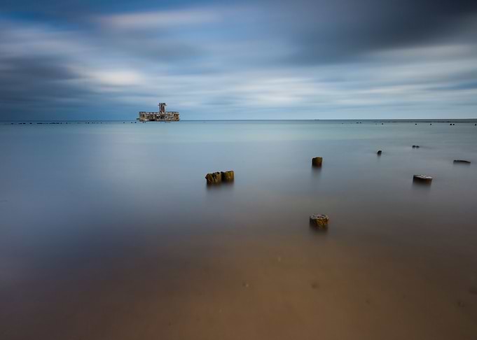 Beach With Old Military Bu