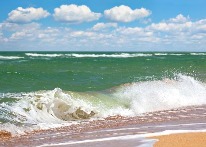 Wave Hitting A Beach In A