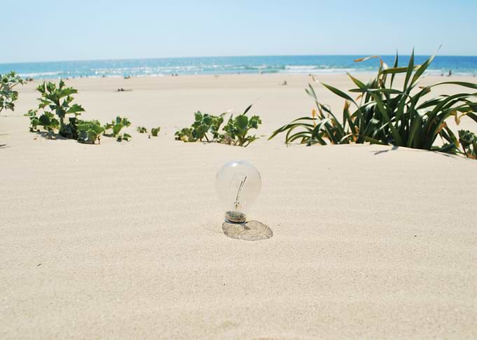 Lightbulb On Sand Global W
