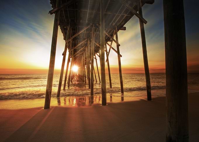Sunset Through The Pier