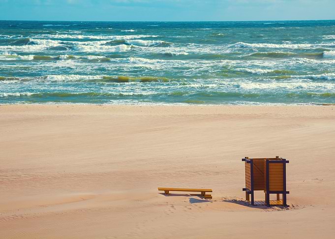 Deserted Beach Bench On Th