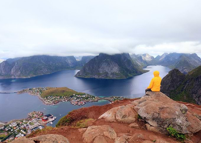Male Tourist Sitting On Th
