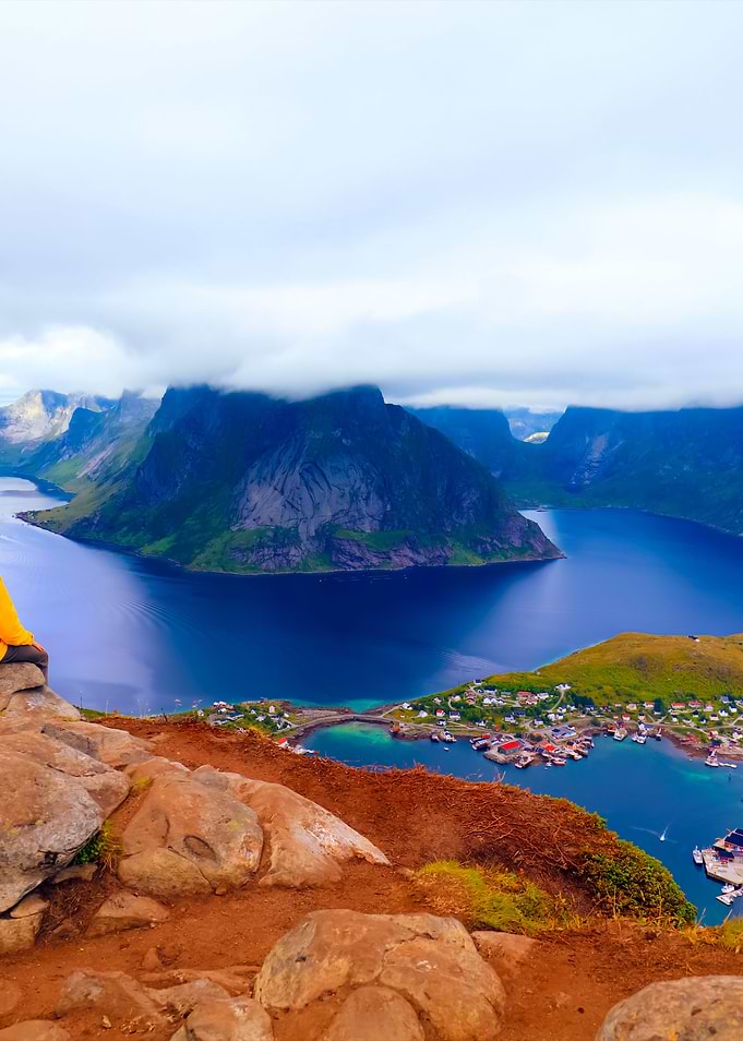 Male Tourist Sitting On Th