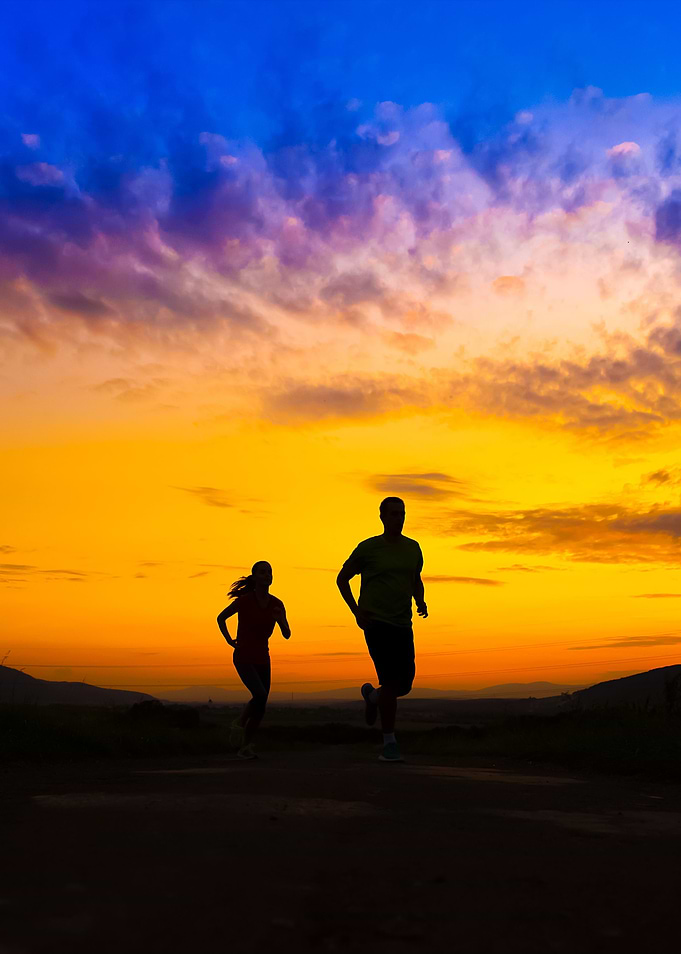 Silhouette Of Couple Runni