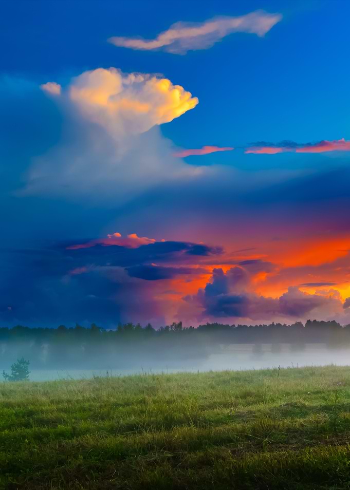 Sunset Over A Misty Field