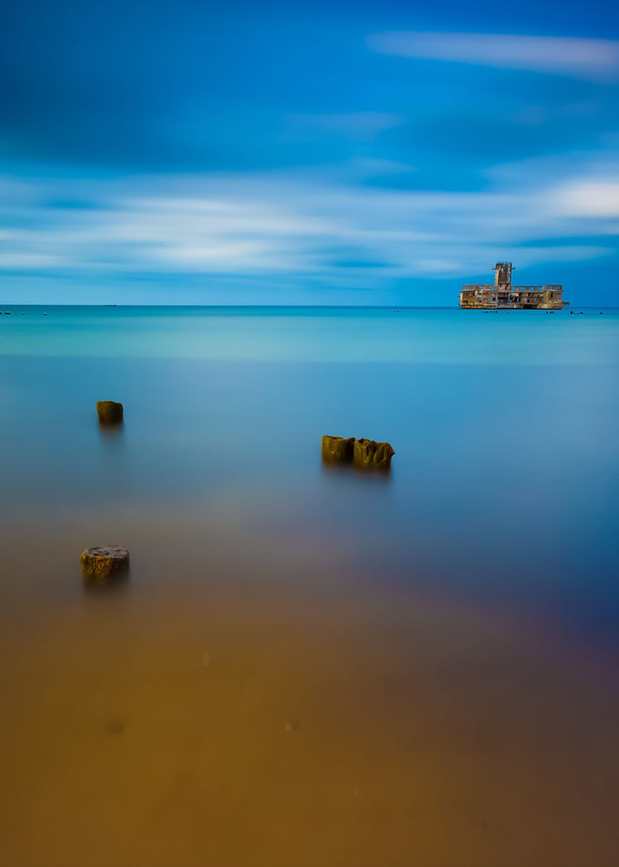 Beach With Old Military Bu