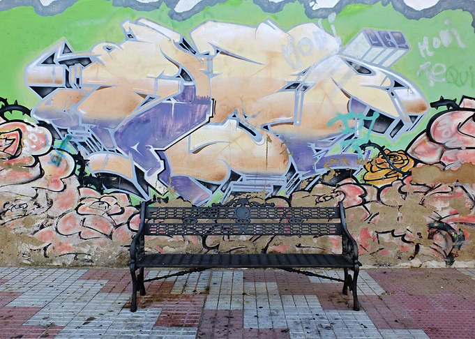 Bench and Grafitti wall