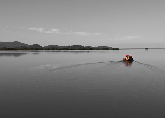 Color boat over calm water
