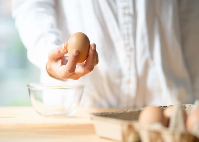 woman pick egg