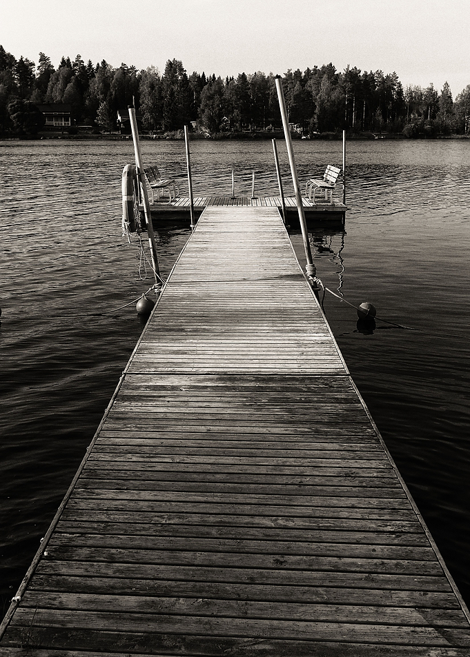 Wooden Benches On A Pier