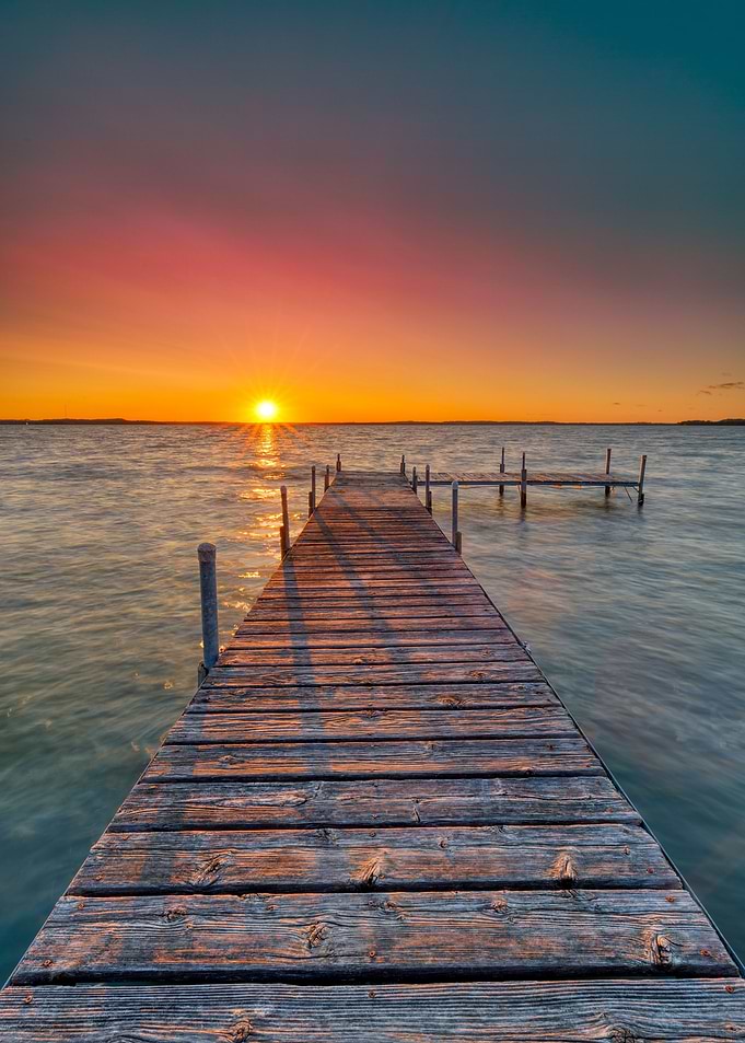 Pier sunset at the sea