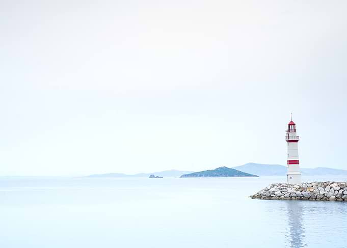 Lighthouse in a foggy sea