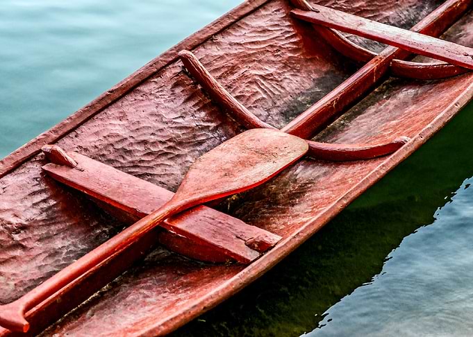 Red Boat And Paddle