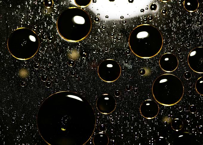 Oil bubbles on water macro