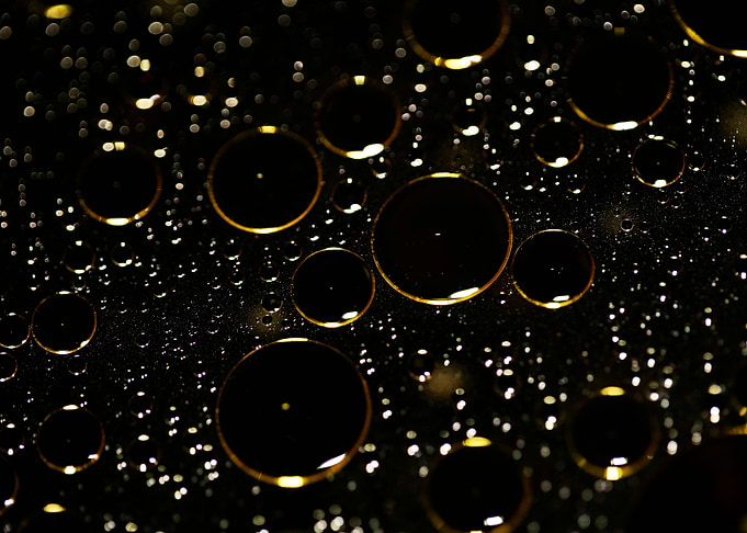 Oil bubbles on water macro