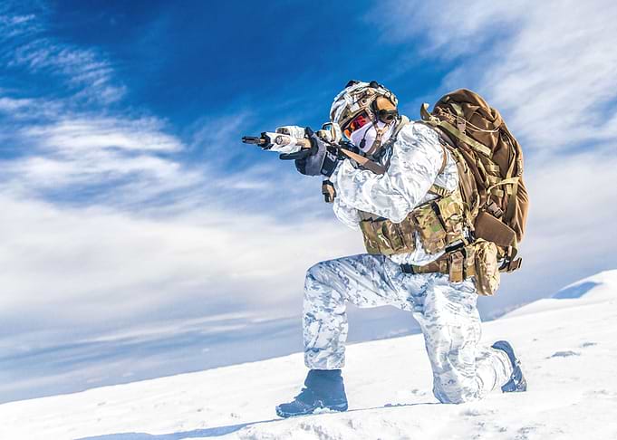 Army soldier with weapon i