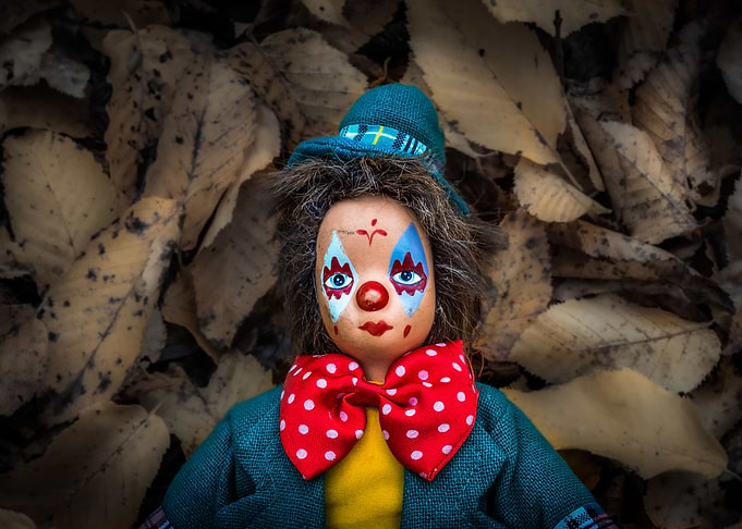 Moody autumn clown doll