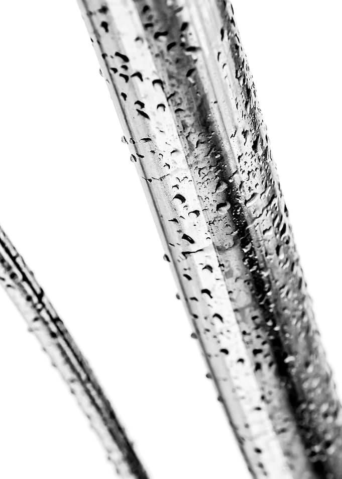 Wet Metal Pipes On White