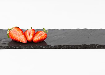 Three strawberries on slat