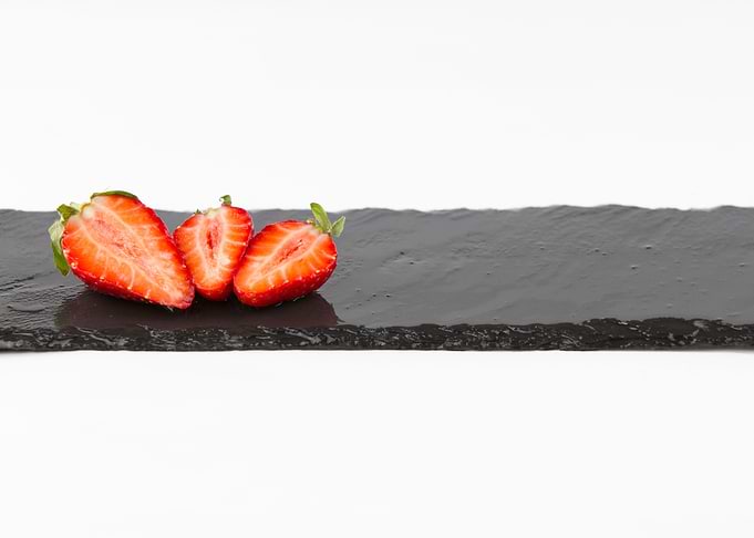 Three strawberries on slat