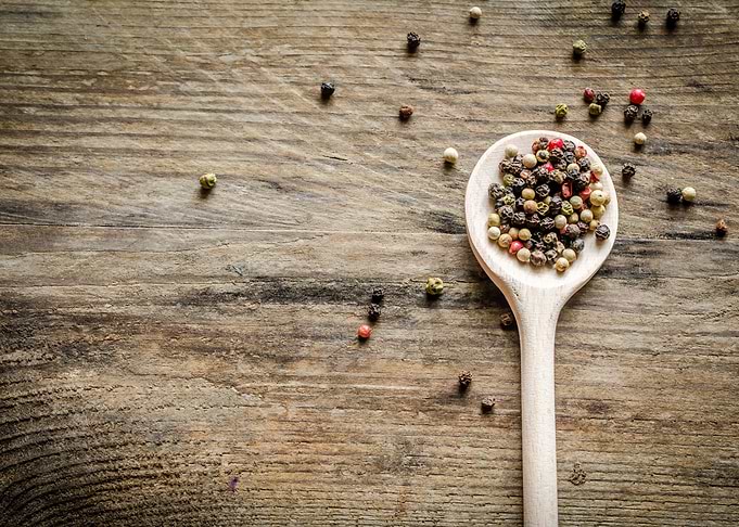 Wooden spoon with pepper