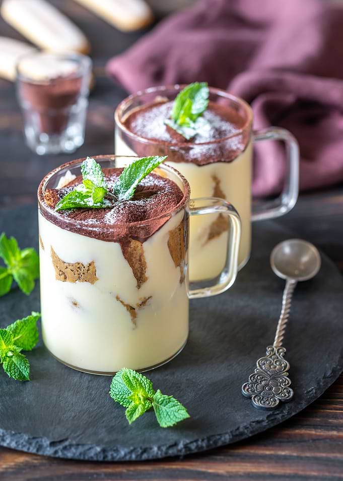 Two glass mugs of tiramisu