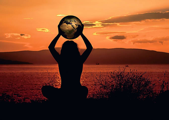 Woman with globe of earth
